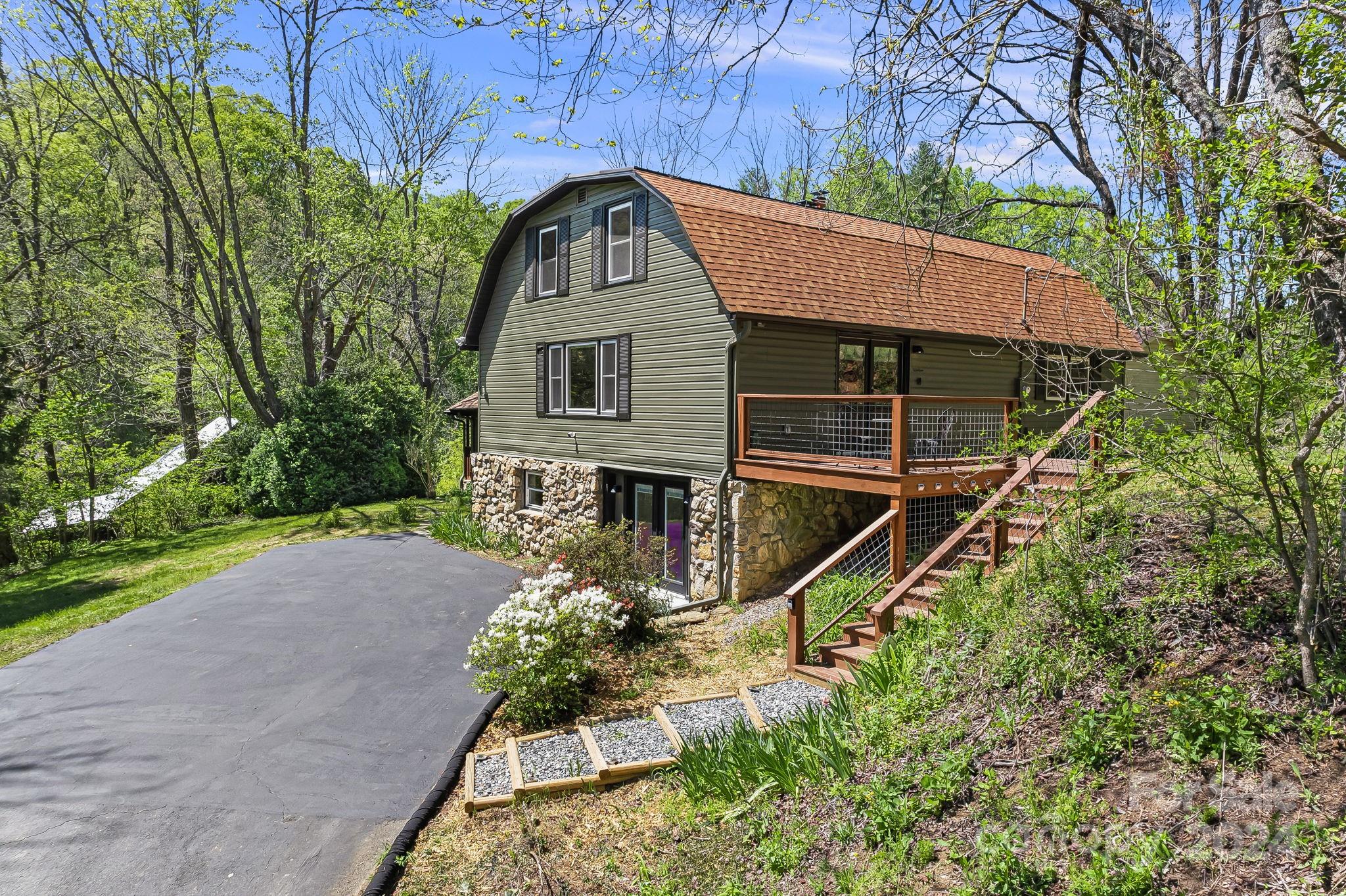 850 East Fork Road Marshall, NC 28753 - Photo 2 of 48 a front view of a house with a yard