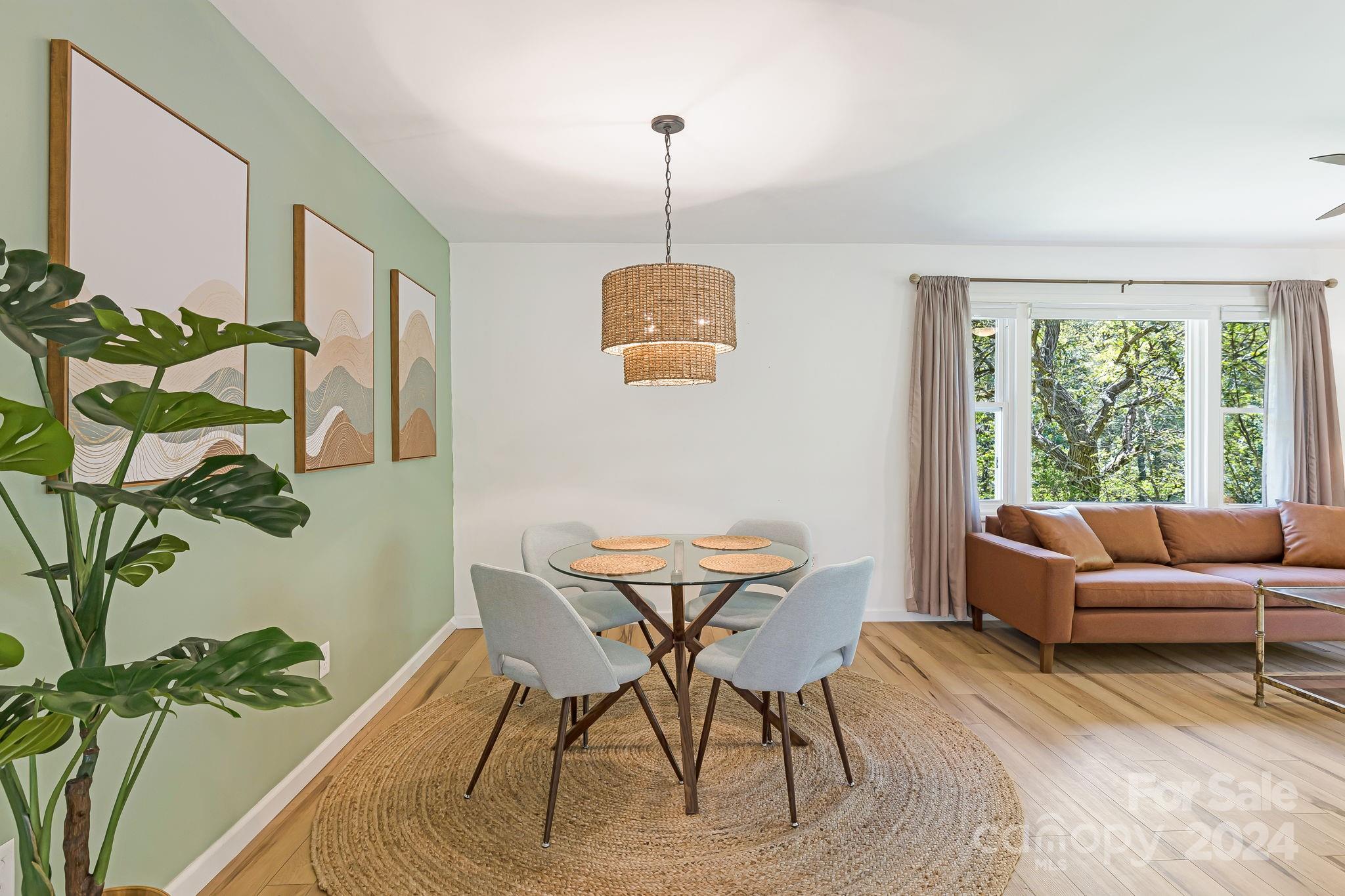 850 East Fork Road Marshall, NC 28753 - Photo 23 of 48 a dining room with furniture and a potted plant