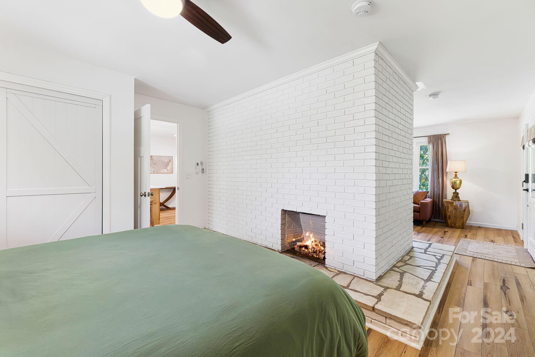 850 East Fork Road Marshall, NC 28753 - Photo 27 of 48 a bedroom with a bed and a view of kitchen