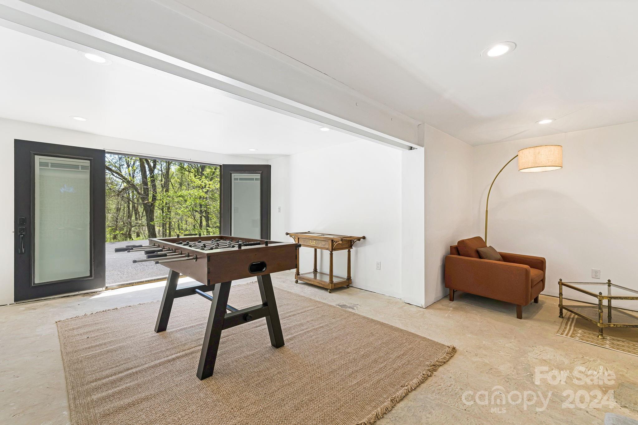 850 East Fork Road Marshall, NC 28753 - Photo 28 of 48 a work room with furniture and a window