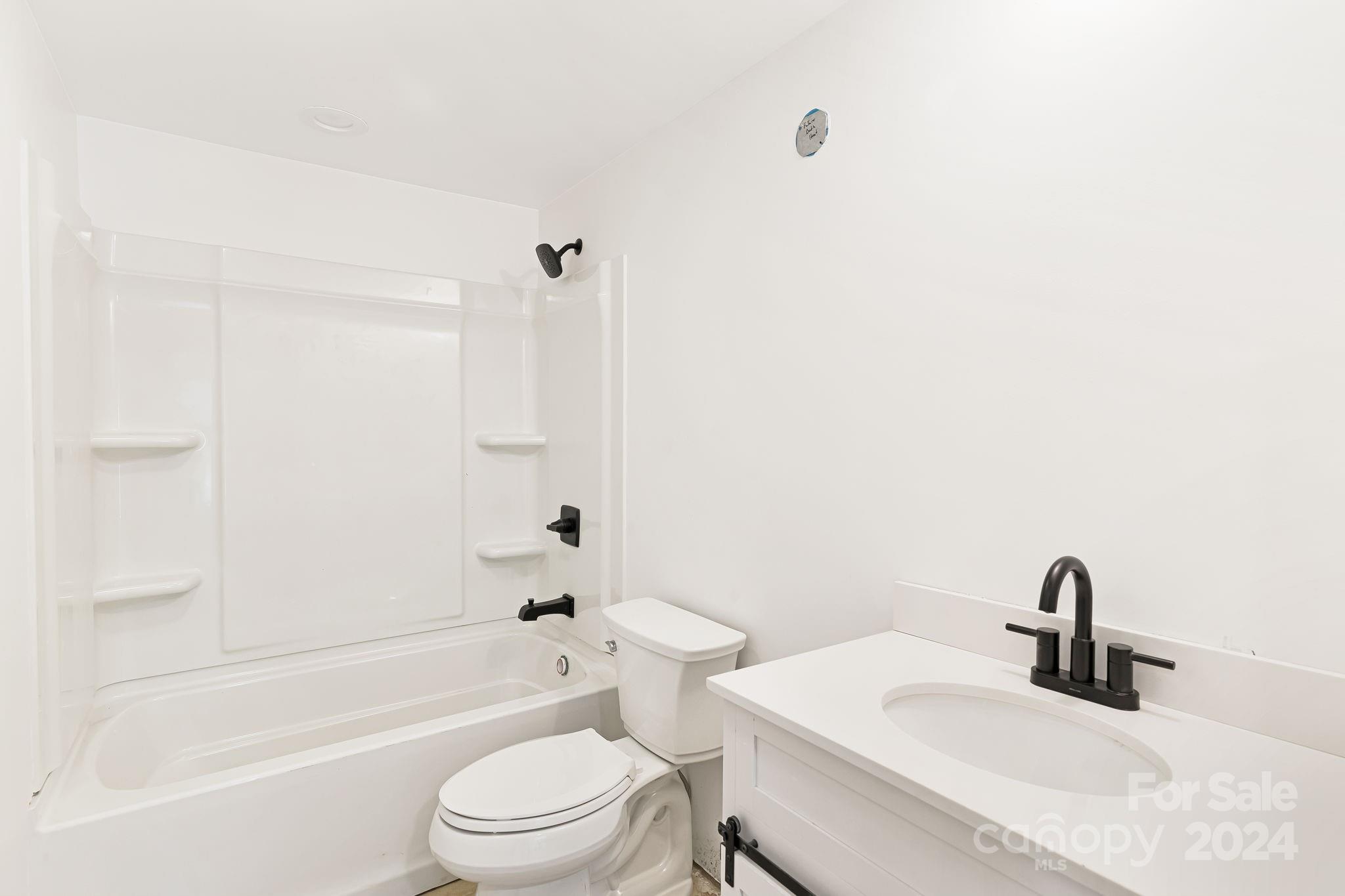 850 East Fork Road Marshall, NC 28753 - Photo 30 of 48 a bathroom with a sink a toilet and a bathtub