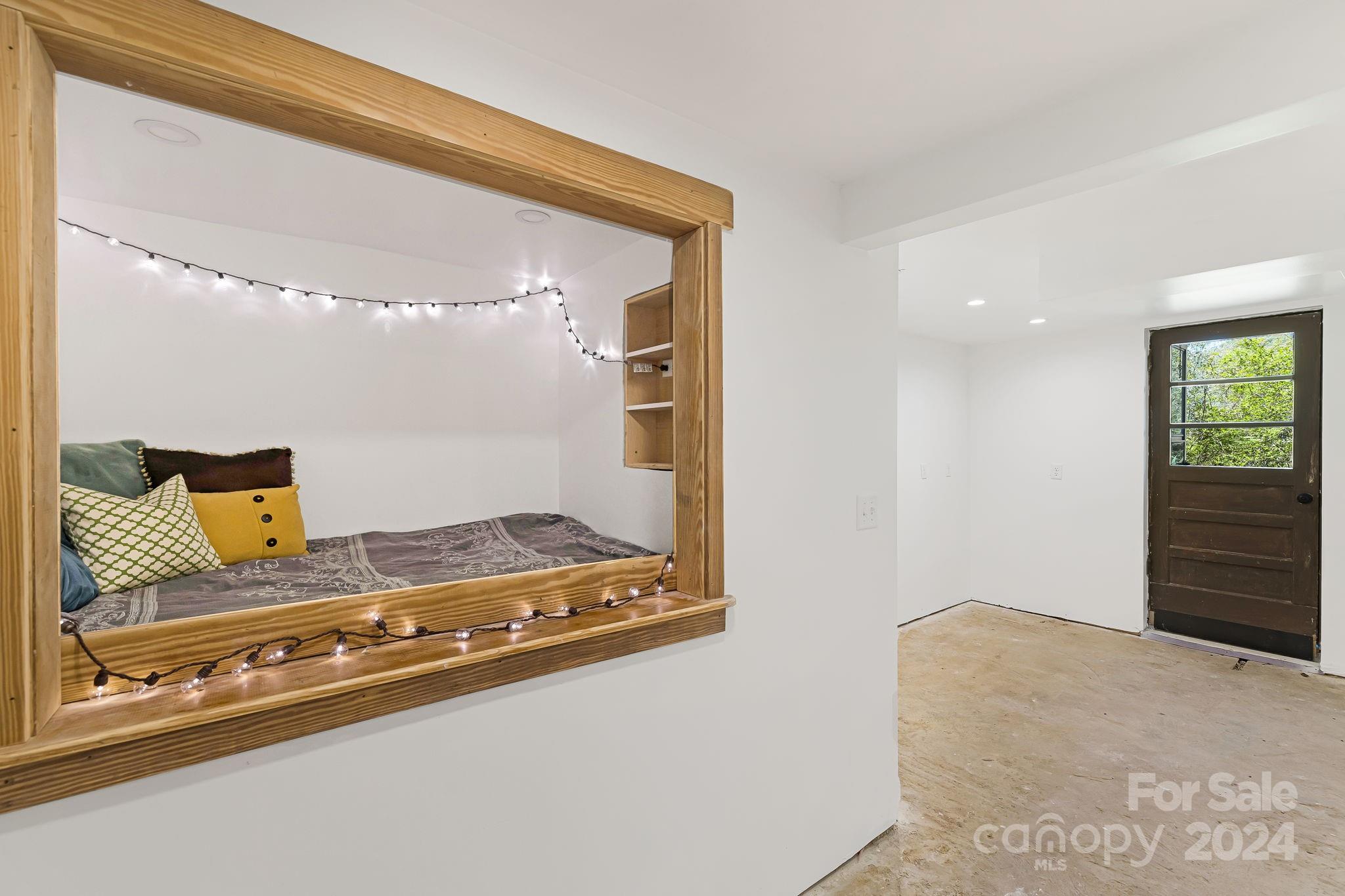 850 East Fork Road Marshall, NC 28753 - Photo 31 of 48 a bedroom with a bed and a dresser