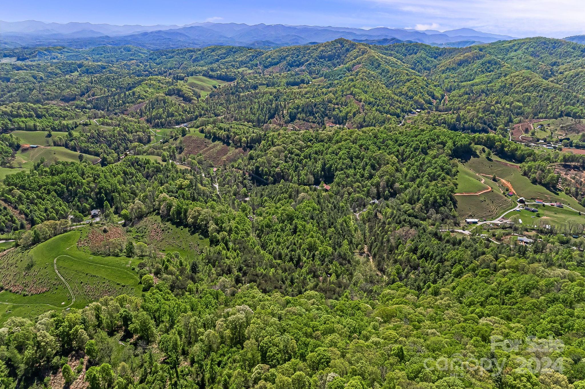 850 East Fork Road Marshall, NC 28753 - Photo 39 of 48 an aerial view of a houses with a lush green hillside