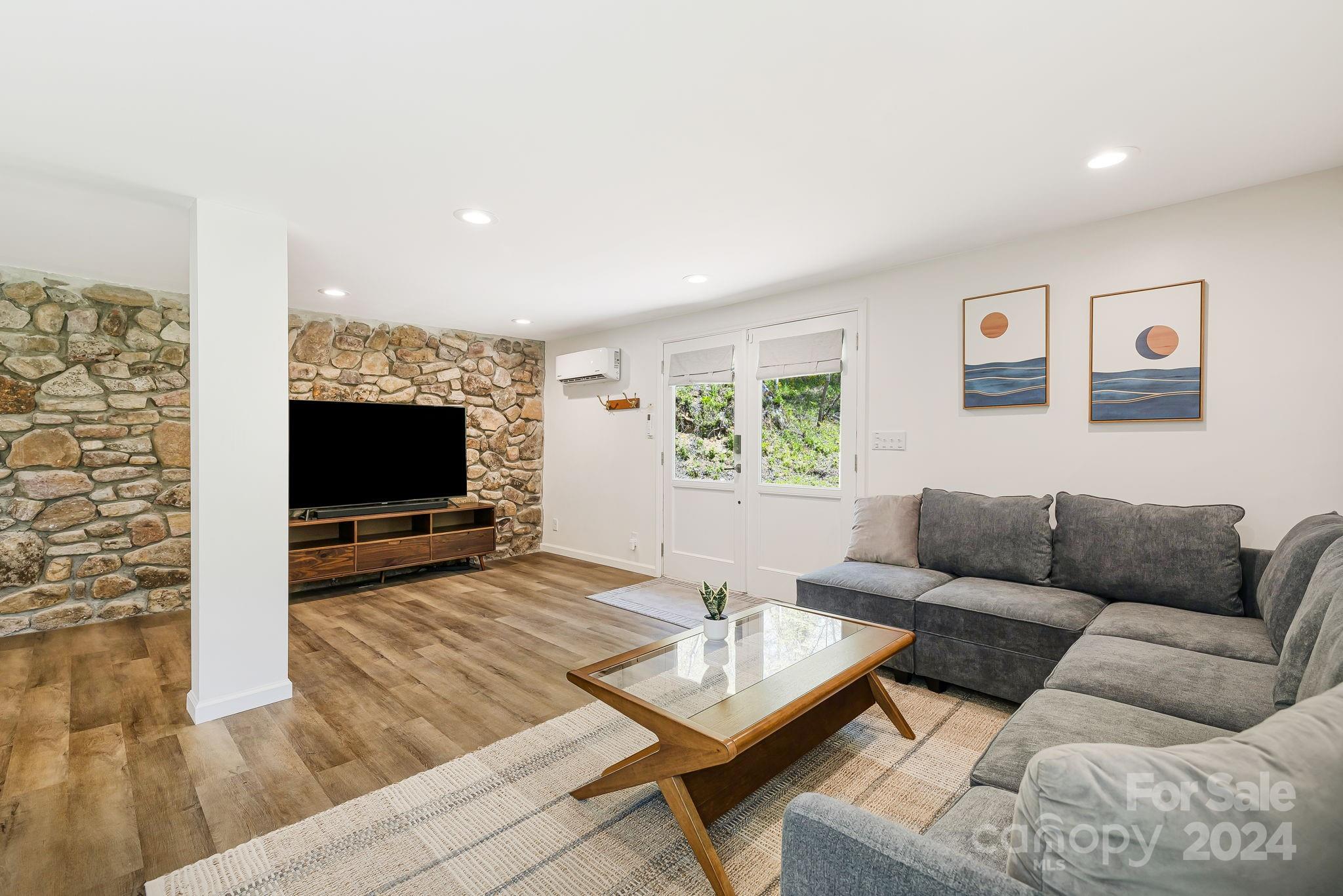 850 East Fork Road Marshall, NC 28753 - Photo 8 of 48 a living room with furniture and a flat screen tv