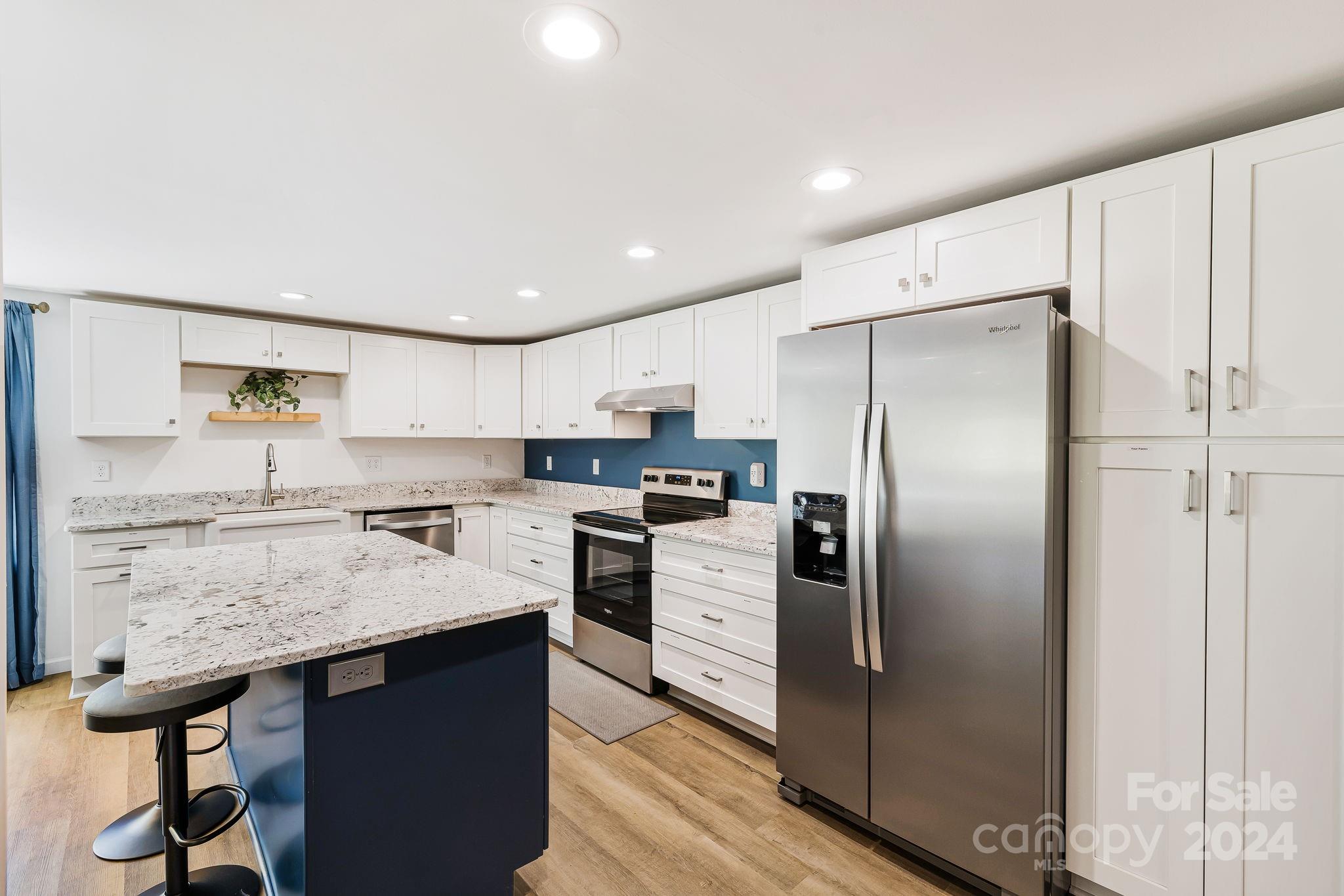 850 East Fork Road Marshall, NC 28753 - Photo 9 of 48 a kitchen with a refrigerator and a sink