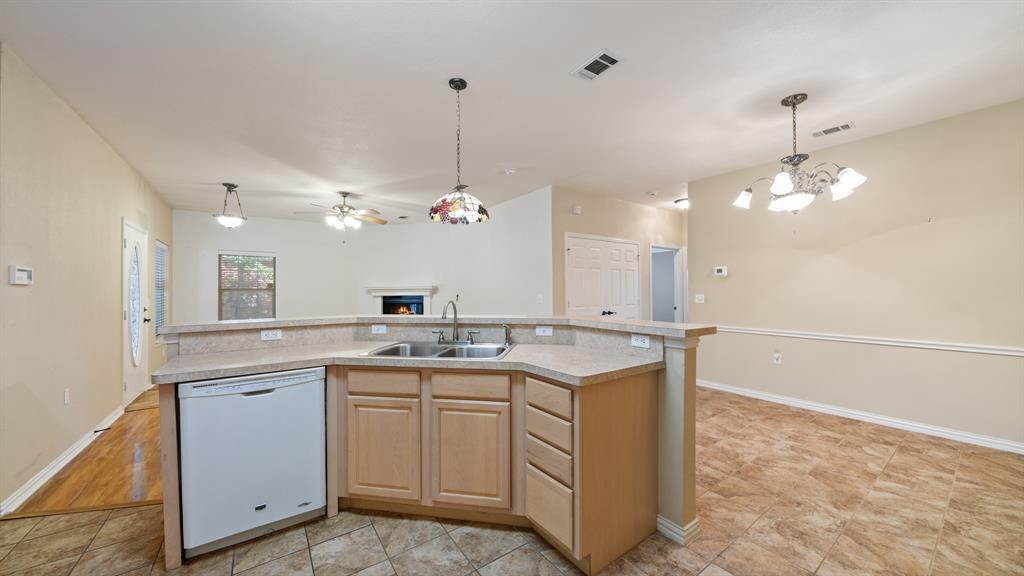 111 Sunglow Loop Red Oak, TX 75154 - Photo 11 of 25 a kitchen with a sink and cabinets