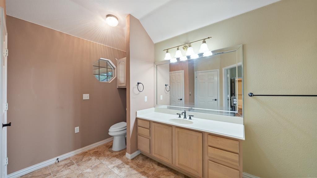 111 Sunglow Loop Red Oak, TX 75154 - Photo 16 of 25 a bathroom with a double vanity sink mirror and toilet