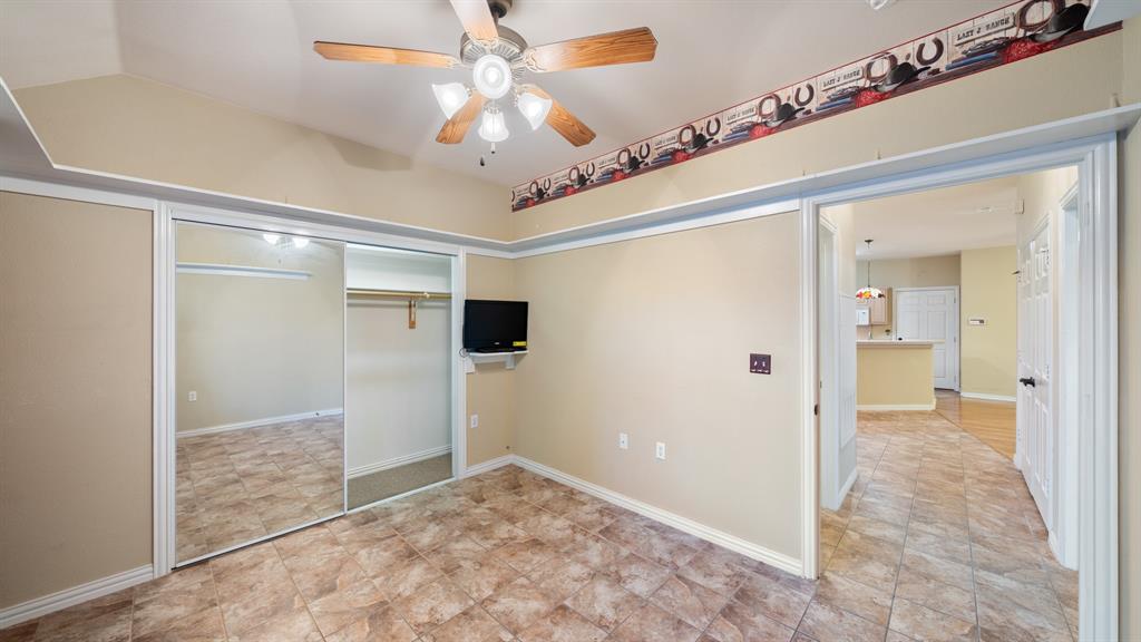 111 Sunglow Loop Red Oak, TX 75154 - Photo 20 of 25 a view of a hallway with a chandelier fan and refrigerator