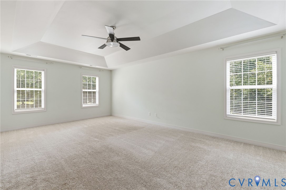 13524 Mountcastle Road Chesterfield, VA 23832 - Photo 17 of 44 Spacious room featuring a tray ceiling, ceiling fa