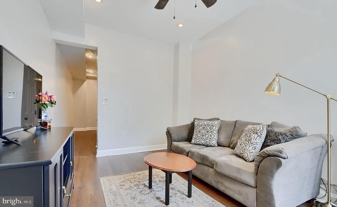 a living room with furniture and a bathroom