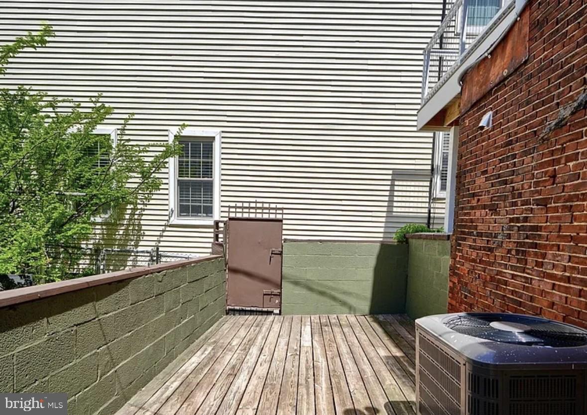 2242 East Fairmount Avenue Baltimore, MD 21231 - Photo 6 of 8 a view of a balcony with two chairs