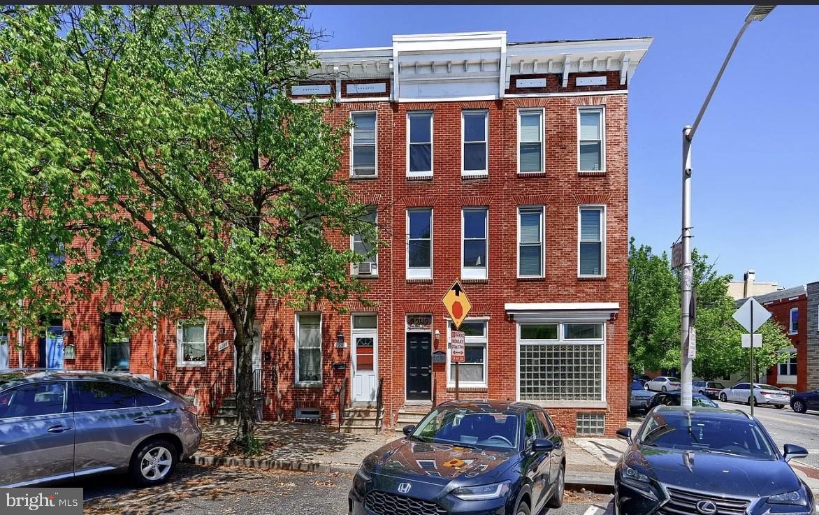 2242 East Fairmount Avenue Baltimore, MD 21231 - Photo 7 of 8 a car parked in front of a building
