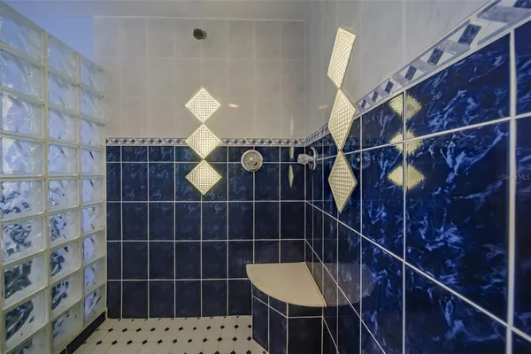 a bathroom with a sink a toilet and a shower