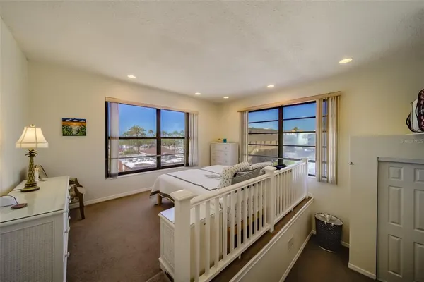 a bed room with furniture and a window