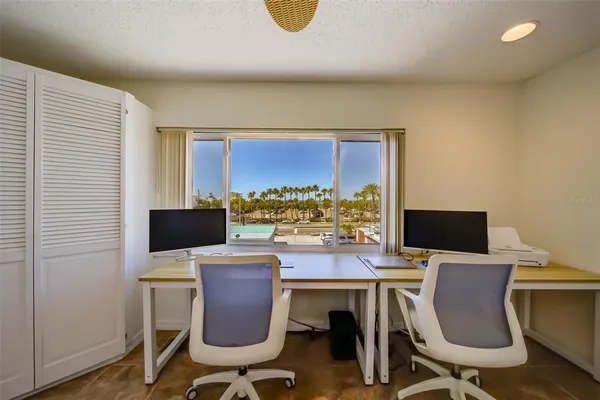 a view of a workspace with furniture