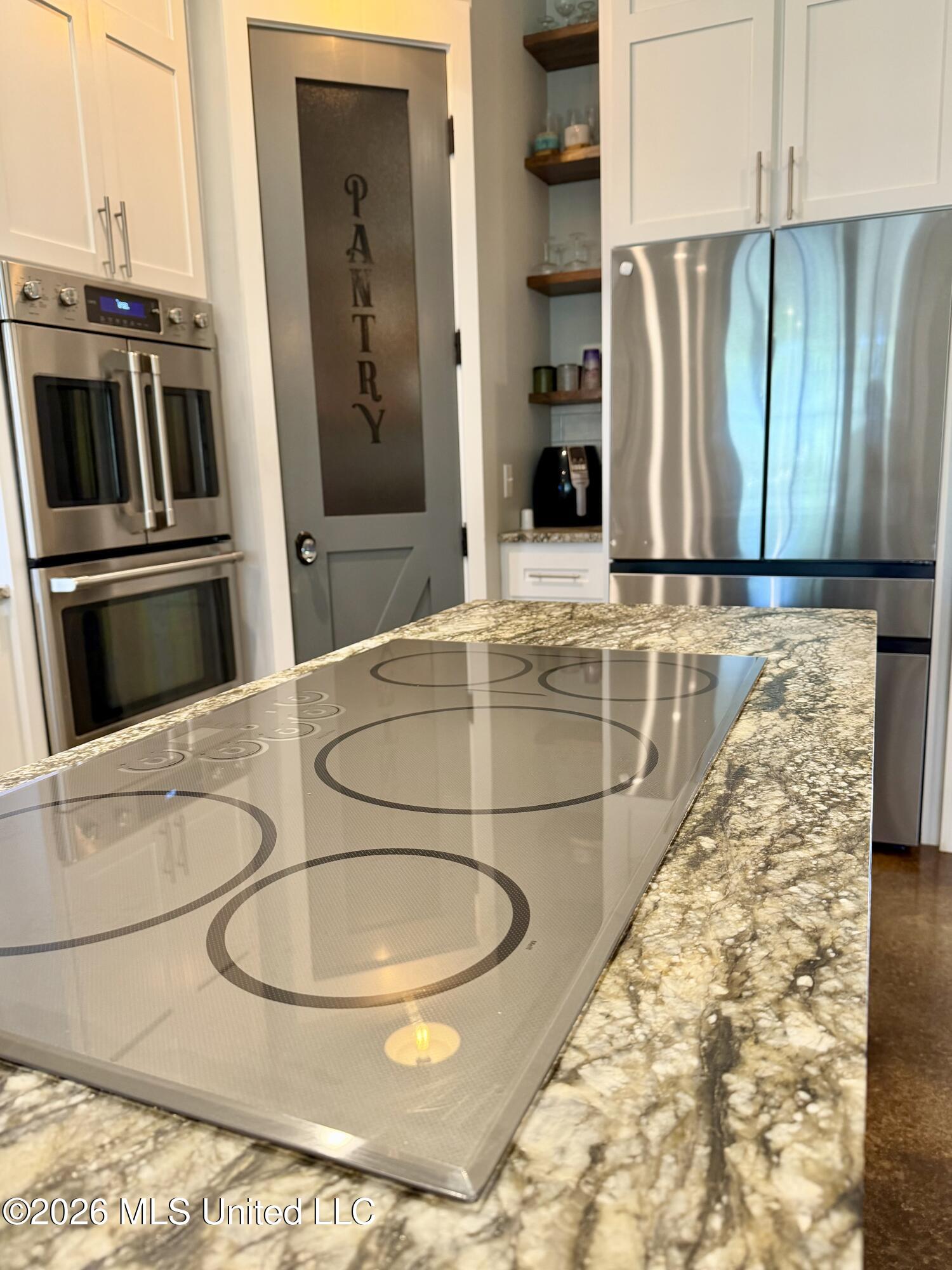 464 Goss Bunker Hill Road Columbia, MS 39429 - Photo 15 of 26 INDUCTION STOVETOP, DOUBLE OVEN, FRIDGE