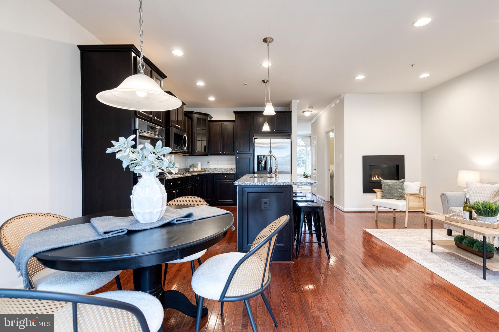 7951 Silver Oak Road Hanover, MD 21076 - Photo 19 of 41 a view of a dining room with furniture and wooden floor