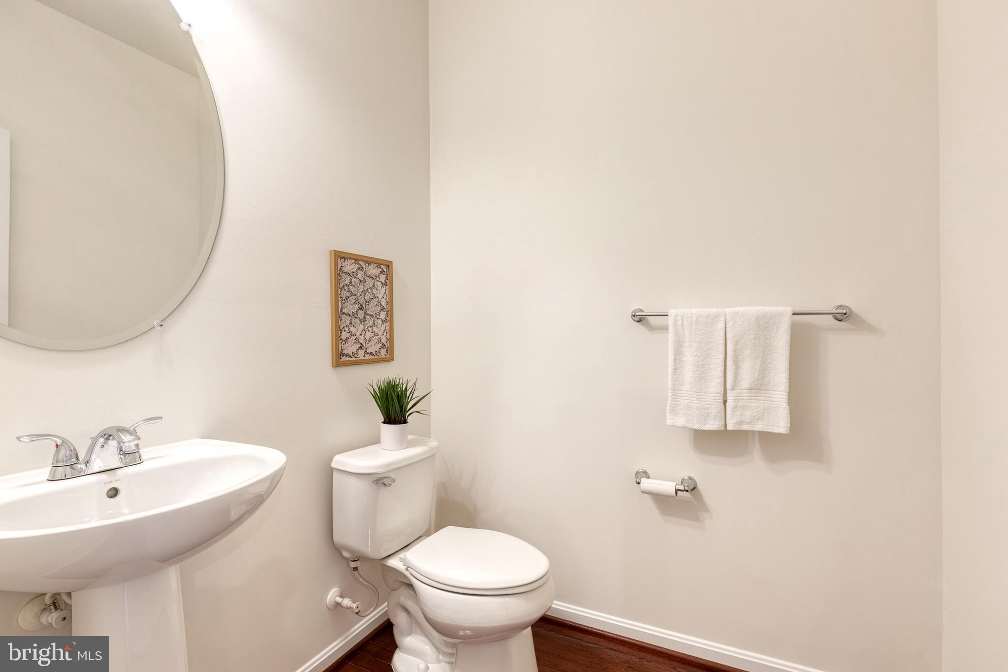7951 Silver Oak Road Hanover, MD 21076 - Photo 24 of 41 a bathroom with a sink a toilet and mirror
