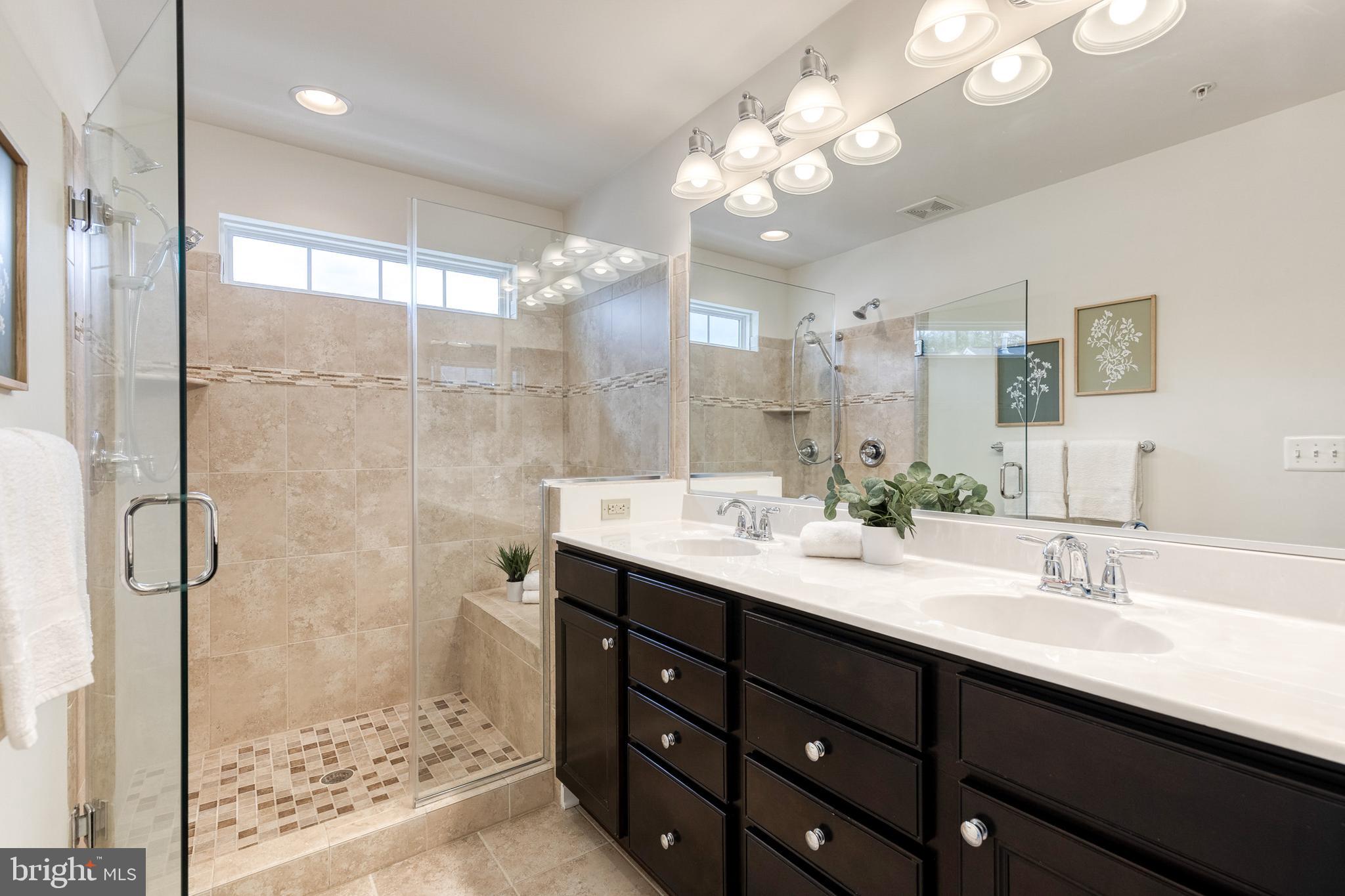 7951 Silver Oak Road Hanover, MD 21076 - Photo 28 of 41 a bathroom with a double vanity sink mirror and shower