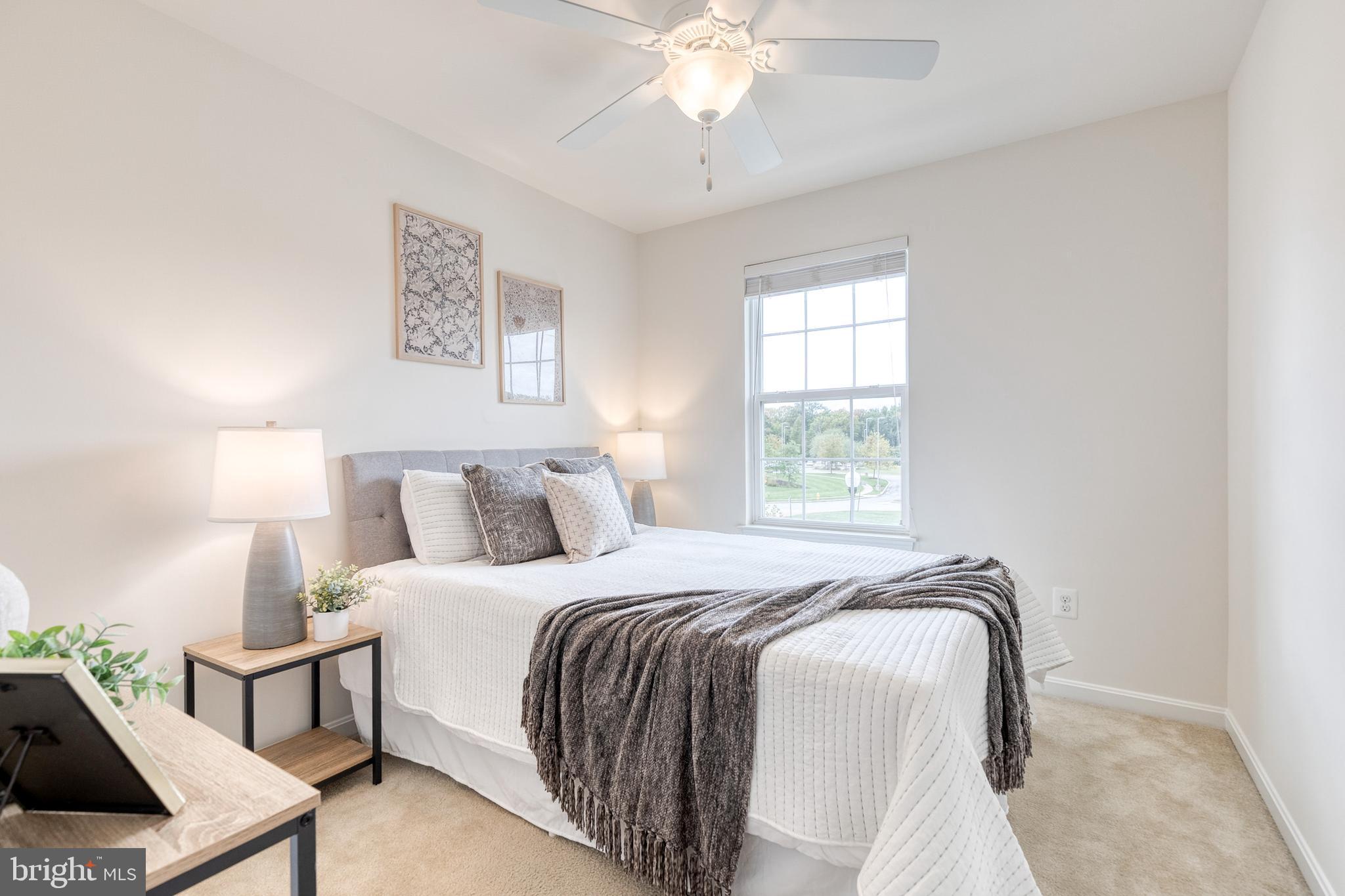 7951 Silver Oak Road Hanover, MD 21076 - Photo 30 of 41 a bedroom with a bed and a chandelier