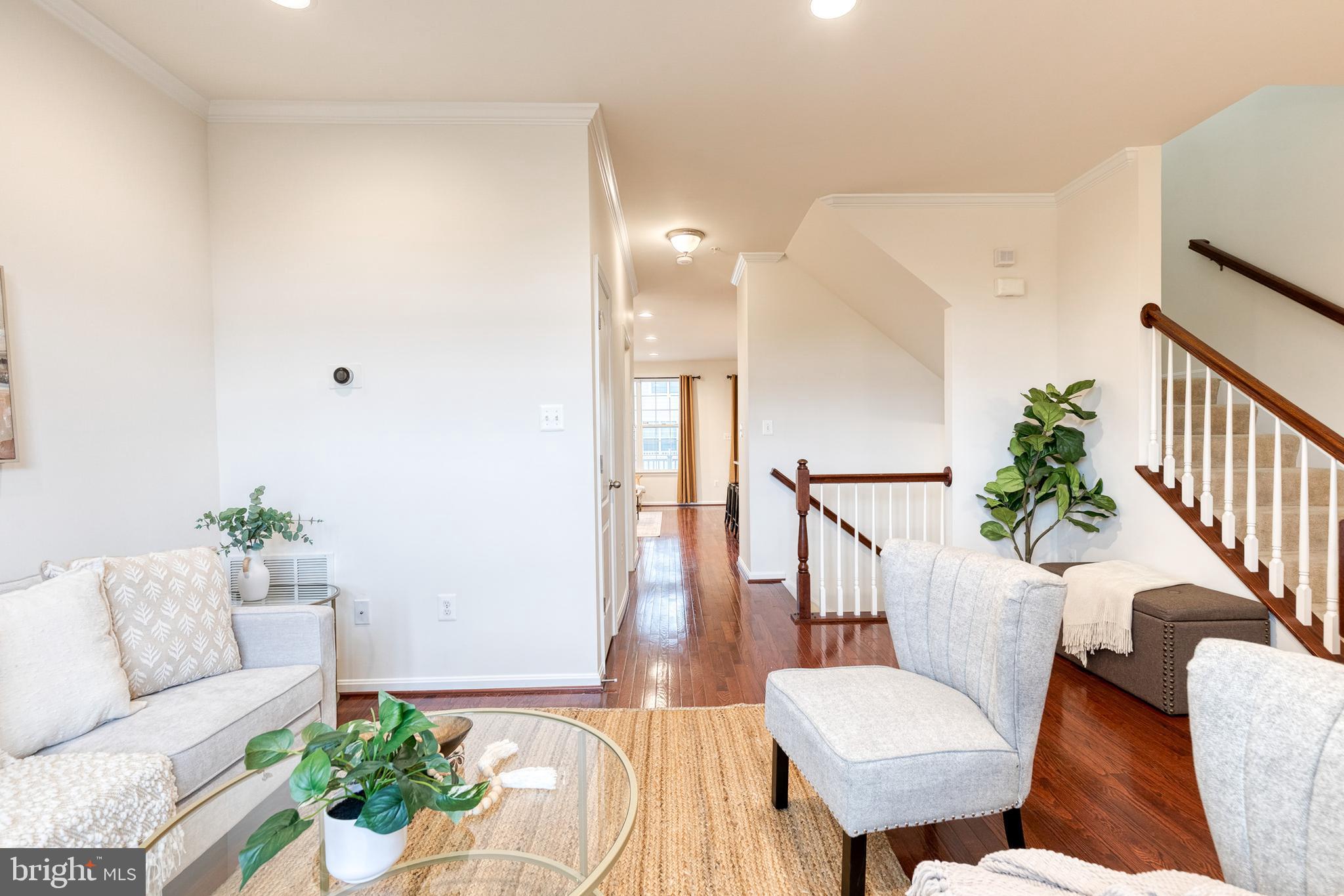 7951 Silver Oak Road Hanover, MD 21076 - Photo 5 of 41 a living room with furniture and a potted plant