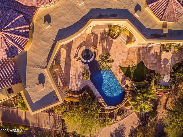 a terrace with a bench and trees