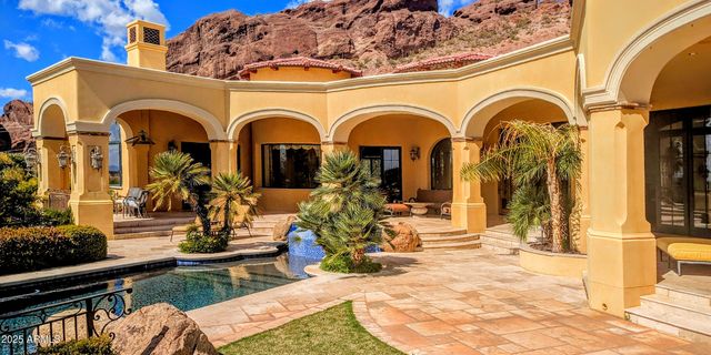 a view of a swimming pool with a sitting space