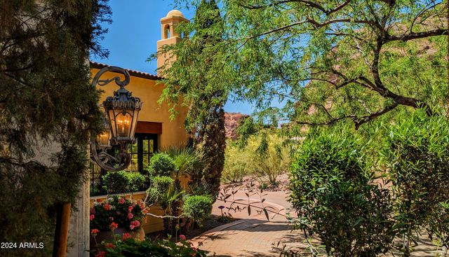 a bed room with a bed and a mirror