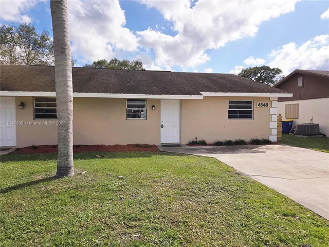 front view of house with a yard