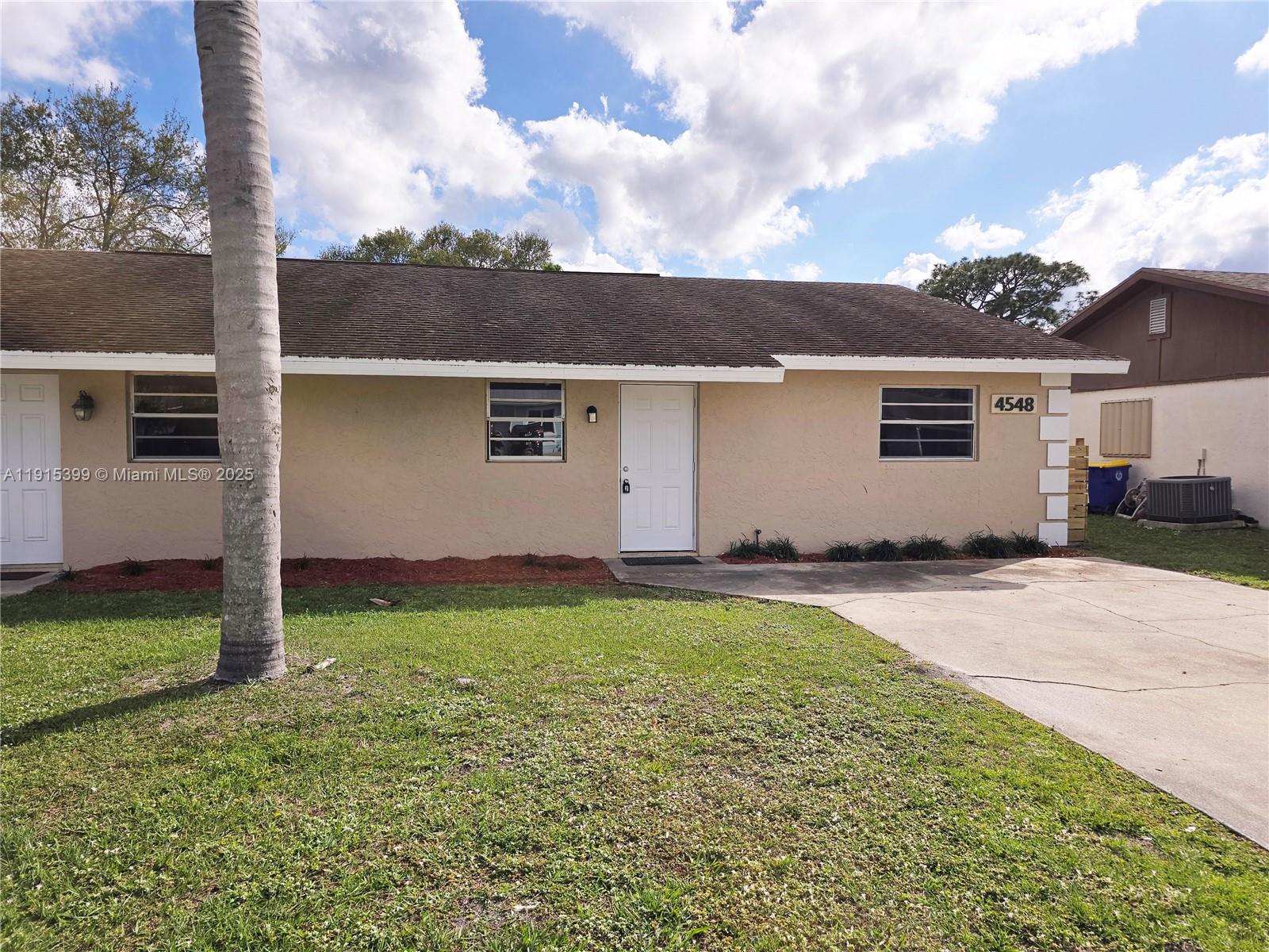 front view of house with a yard