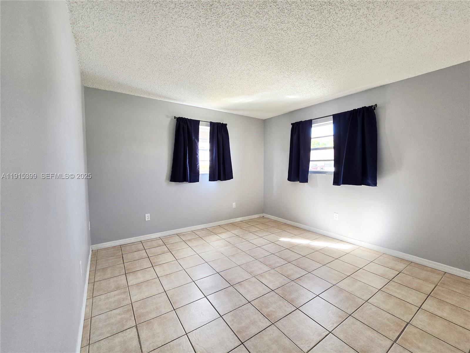 4548 Southeast Salvatori Road Stuart, FL 34997 - Photo 9 of 11 a view of an empty room and window