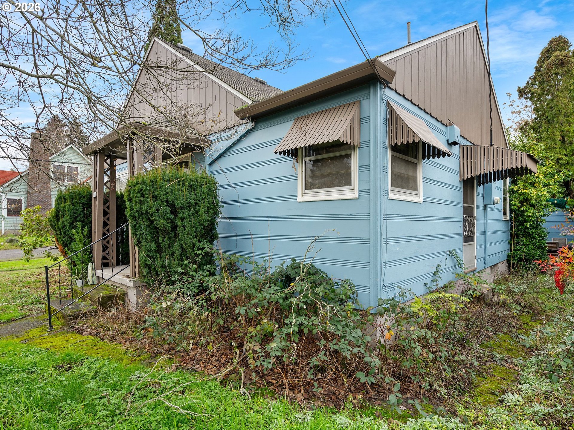3306 Southeast 56th Avenue Portland, OR 97206 - Photo 14 of 36 a view of a house with a yard and plants
