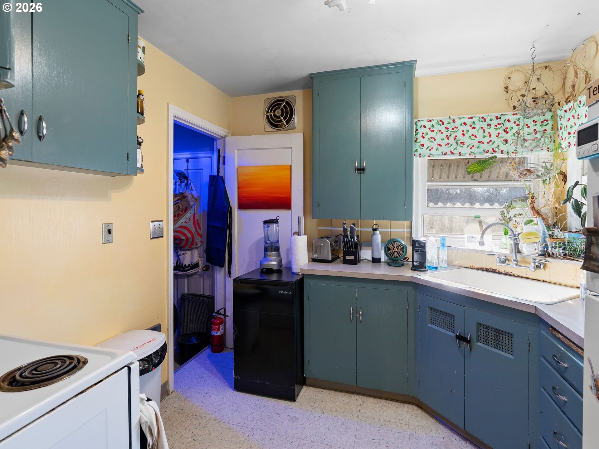 3306 Southeast 56th Avenue Portland, OR 97206 - Photo 30 of 36 a kitchen with stainless steel appliances a sink stove and refrigerator