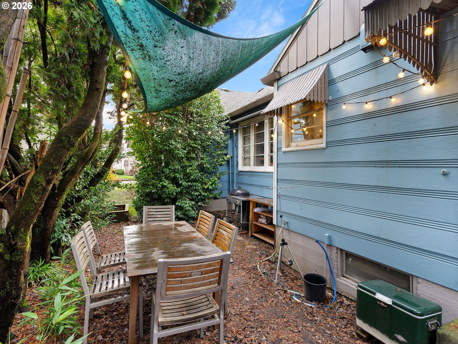 3306 Southeast 56th Avenue Portland, OR 97206 - Photo 8 of 36 a view of a patio with table and chairs with wooden floor and fence