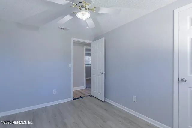 an empty room with a view of a bathroom
