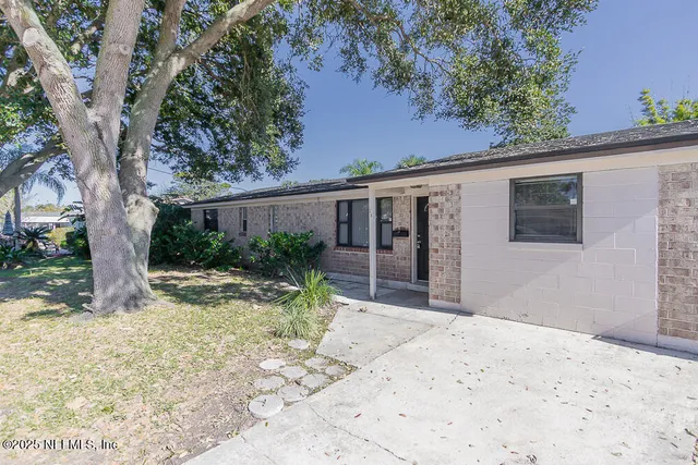 a backyard of a house with seating space