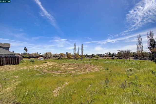 a view of a lake with houses in the back