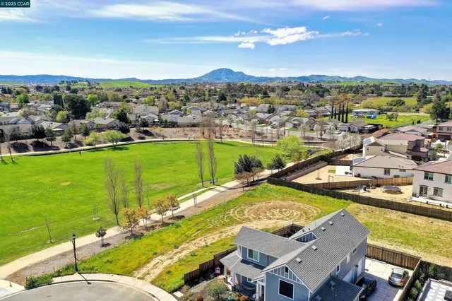 a bathroom with a toilet sink and shower curtain