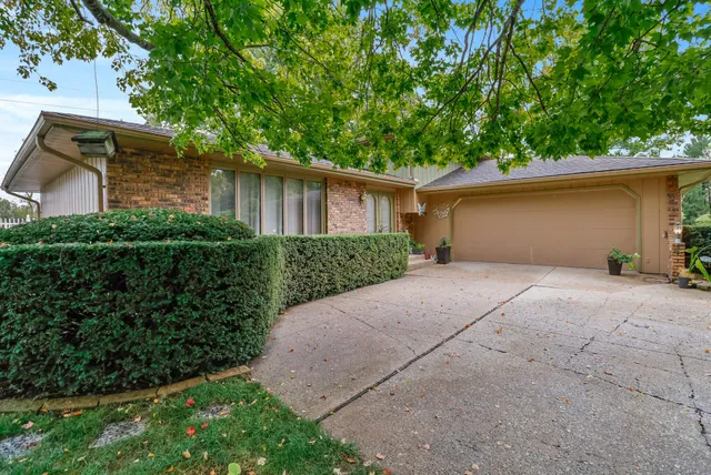 an aerial view of a house with yard