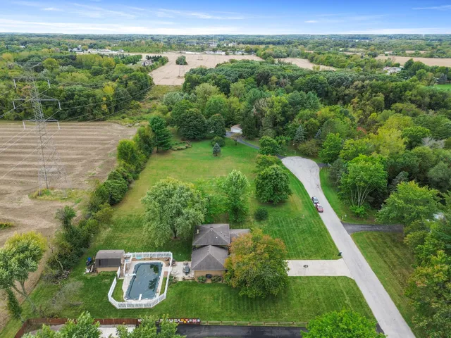 a front view of a house with a yard table and chairs