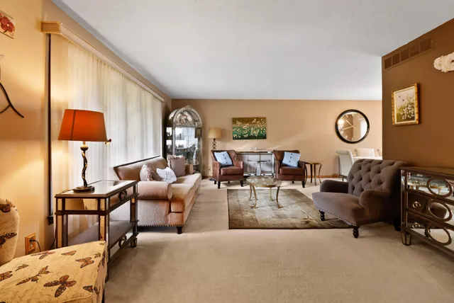 a kitchen with stainless steel appliances granite countertop a sink a stove and a microwave