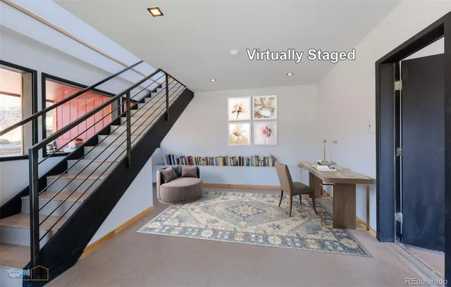 a view of a hallway with furniture