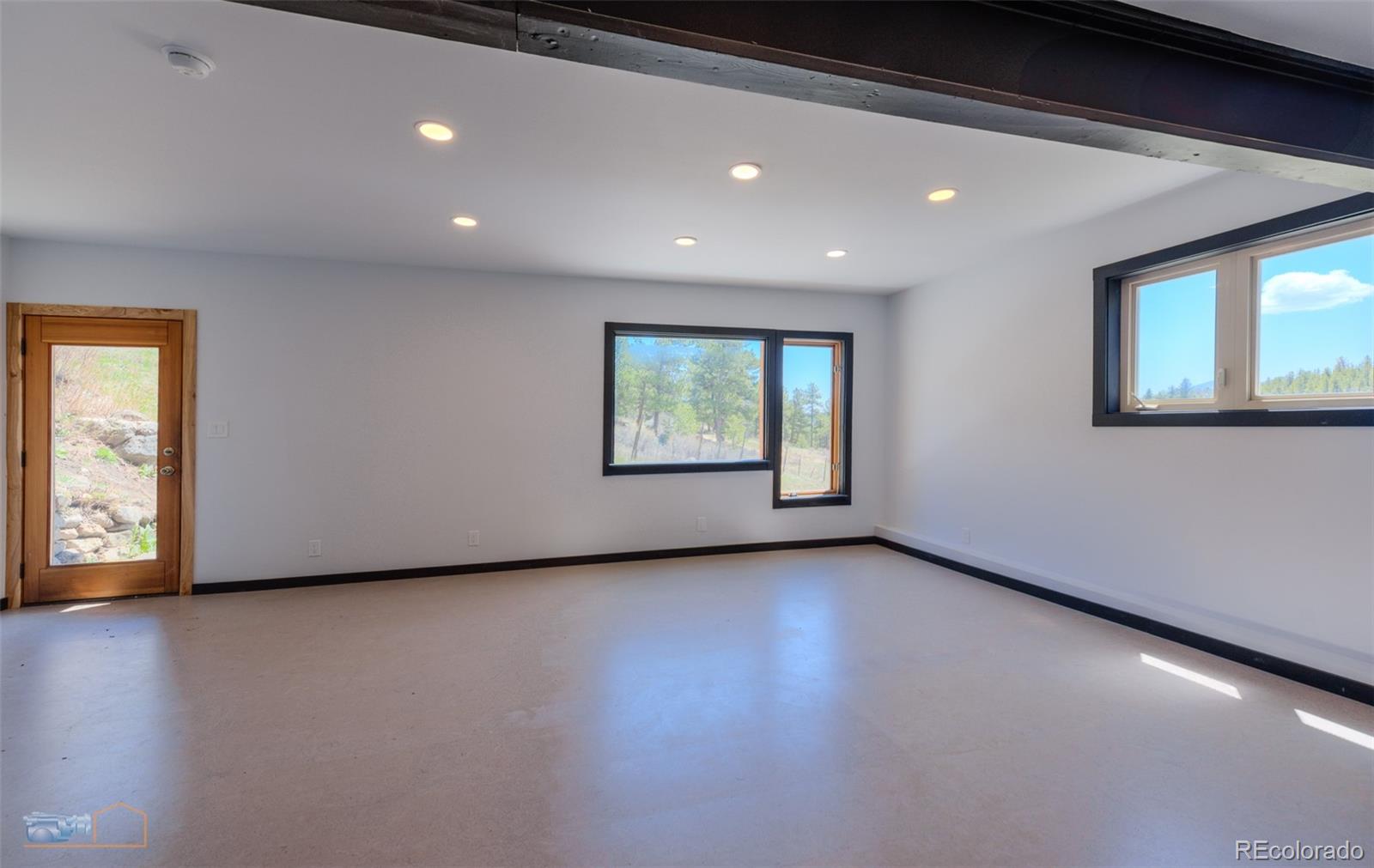 548 Coughlin Meadows Road Boulder, CO 80302 - Photo 14 of 50 an empty room with windows
