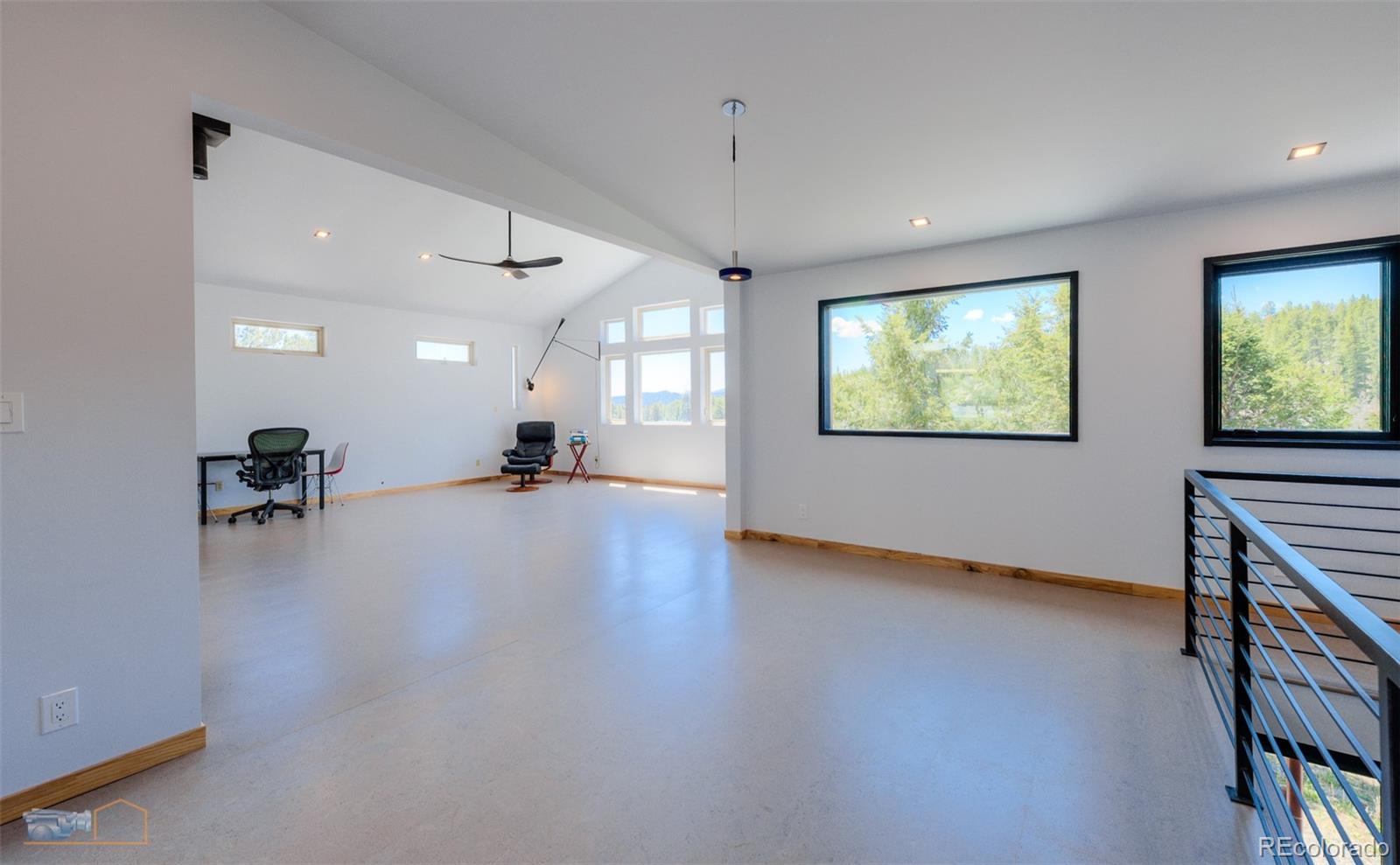 548 Coughlin Meadows Road Boulder, CO 80302 - Photo 18 of 50 a view of an empty room with window and a kitchen