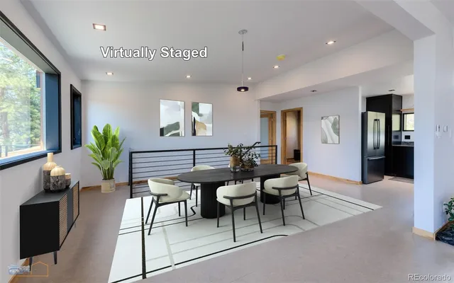 a view of a livingroom with furniture and a potted plant