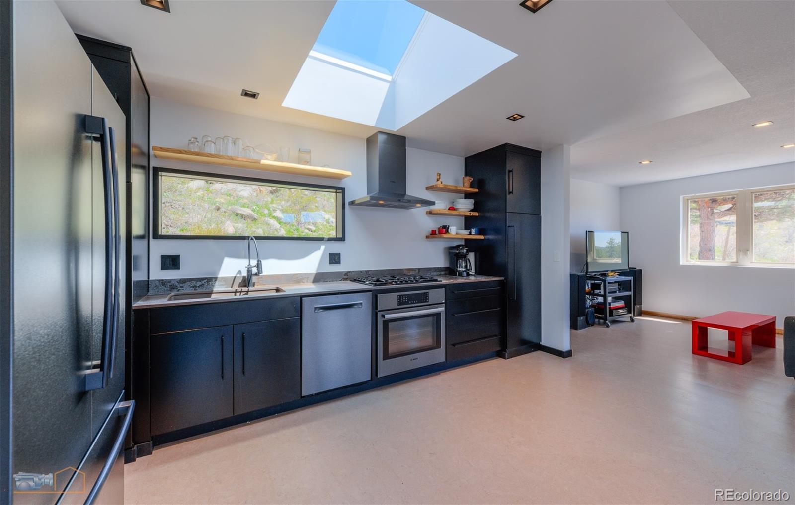 548 Coughlin Meadows Road Boulder, CO 80302 - Photo 21 of 50 a kitchen with stainless steel appliances granite countertop a refrigerator and a sink