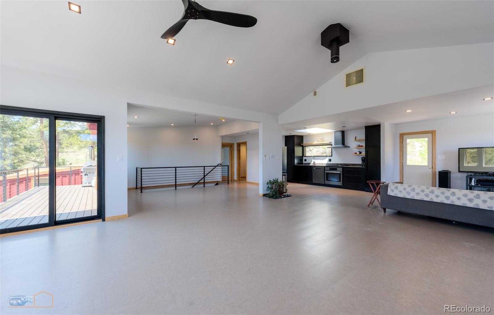 548 Coughlin Meadows Road Boulder, CO 80302 - Photo 27 of 49 a view of a livingroom with furniture hardwood floor and a ceiling fan