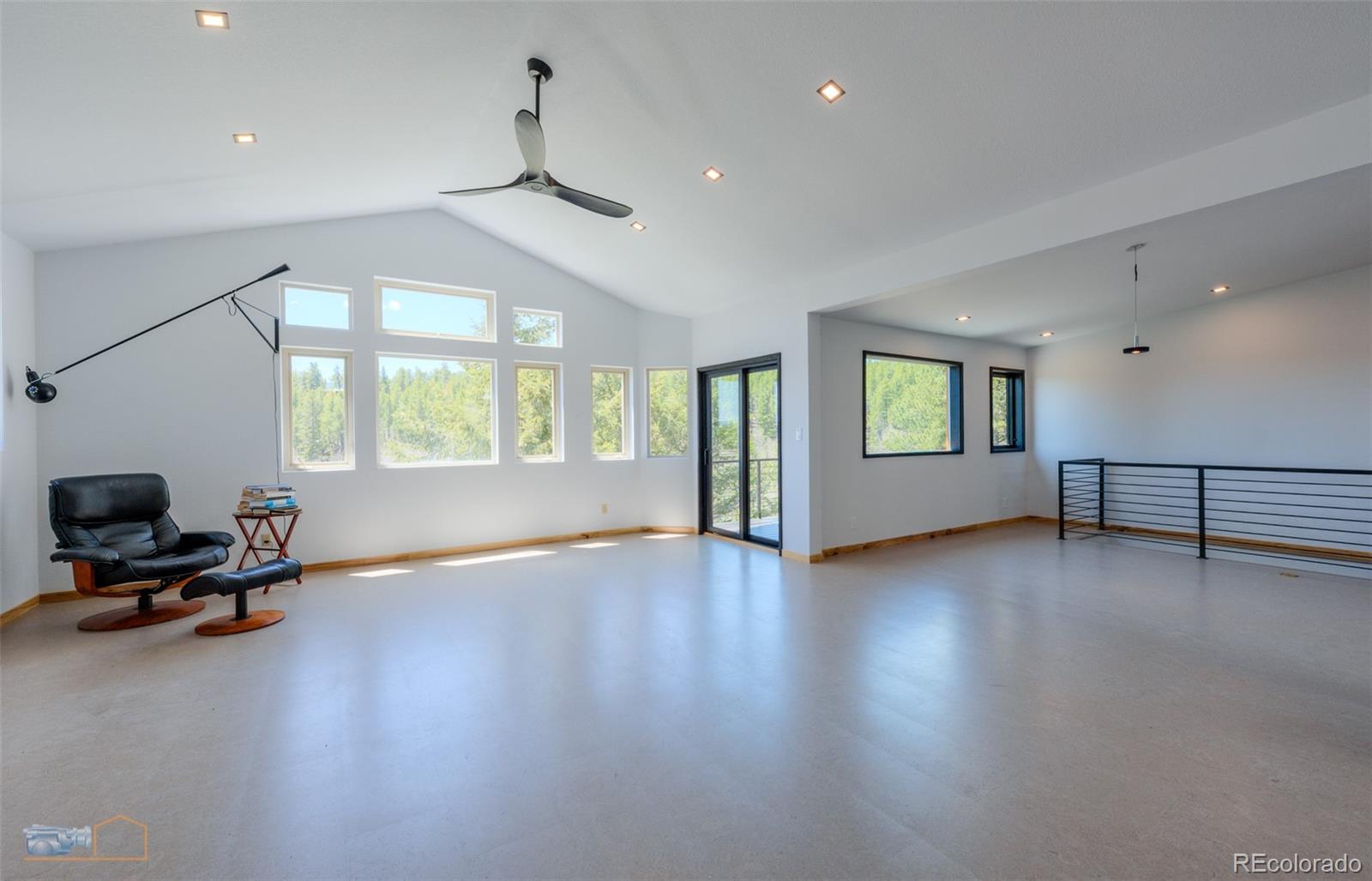 548 Coughlin Meadows Road Boulder, CO 80302 - Photo 34 of 49 a view of a livingroom with furniture a ceiling fan and window