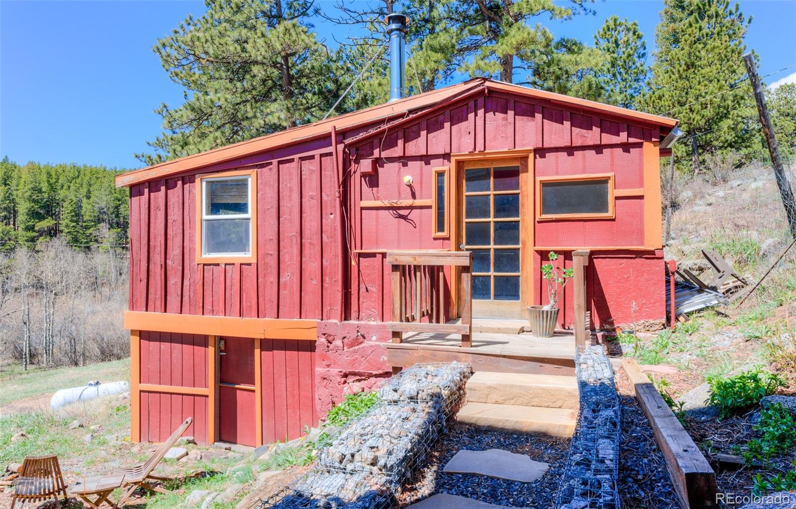 548 Coughlin Meadows Road Boulder, CO 80302 - Photo 40 of 50 a front view of a house with a yard