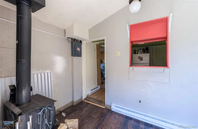 a kitchen with a sink cabinets stainless steel appliances and a window